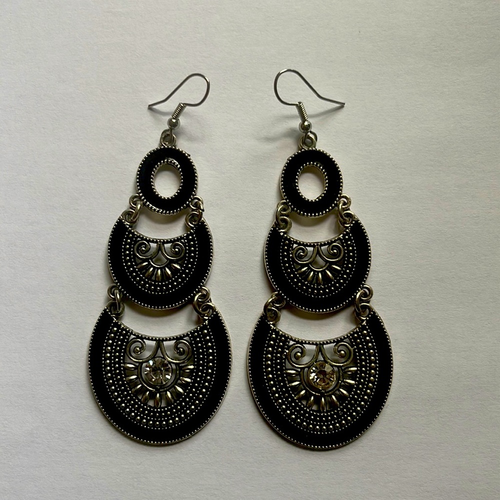 Pair of fashion earrings in black and chrome.